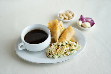Pempek Palembang, served with Kuah Cuko or Vinegar Sauce and diced cucumbers. Is a savory Indonesian fishcake delicacy, made of fish and tapioca. Palembang Culinary, South Sumatra