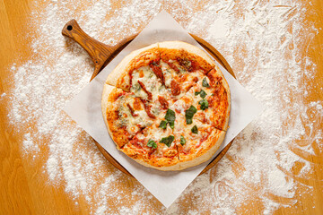 homemade italian pizza on the wooden board