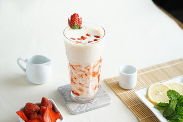Strawberry smoothie or milkshake at white