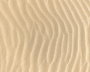 Fototapeta na wymiar Sand. Texture, surface of sea sand. Natural background. Waves of sand. Seascape. Dunes. Copy space 