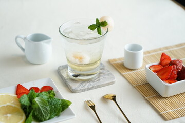 Mint Honey Lime and Lychee cocktail. Lime soda ginger refreshing summer drink. Lychee Mojito