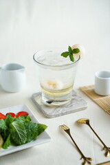 Mint Honey Lime and Lychee cocktail. Lime soda ginger refreshing summer drink. Lychee Mojito