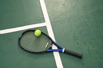 Aerial view of racket and ball on tennis court with copy space. Outdoor sports and healthy...