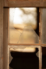 Old timber window frames with broken glass