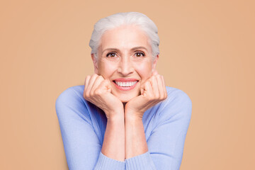 Portrait of gray haired happy beautiful old lady with beaming smile, healthy teeth, isolated over...