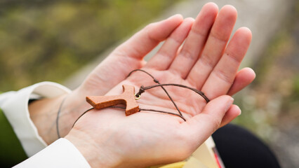 Woman's Hands Clasp Crucifix. Close up.