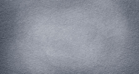Dark grey felt material. Surface of felted fabric texture abstract background in gray color. 
 