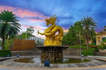 Golden dragon in old phuket town phuket Thailand this dragon is on the middle of a big water pond and fountain Chinese Dragon - obrazy, fototapety, plakaty