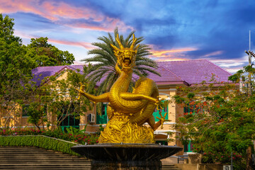 Golden dragon in old phuket town phuket Thailand this dragon is on the middle of a big water pond and fountain Chinese Dragon - obrazy, fototapety, plakaty