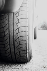 Obraz premium Car wheels on a background of asphalt. Car tires