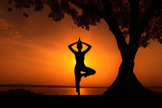 Silhouette of a Woman Practicing Yoga Next to a Tree During Golden Hour – Generative AI