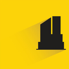 silhouette city building icon with shadow on yellow background