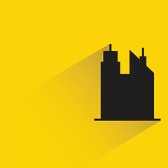 silhouette city building icon with shadow on yellow background