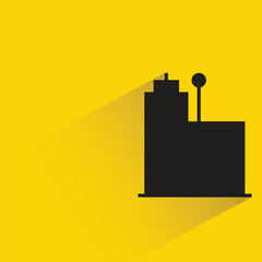 silhouette office building icon with shadow on yellow background