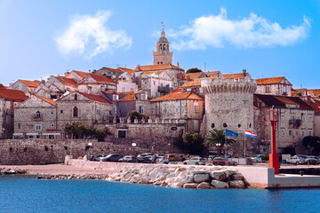 Stone Wall Buildings seen at Korcula Island in Croatia with Croatian and European Union Flags 