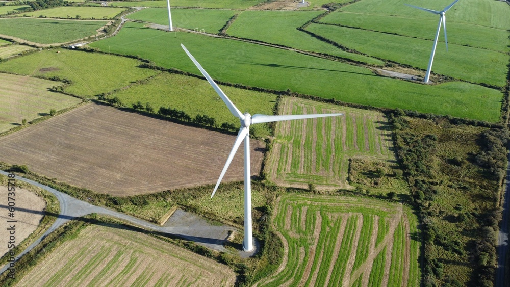 Wall mural Aerial view of windmills in farmland - Wall murals