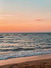 Vertical shot of a beach in the sunset