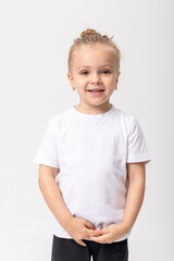 Smiling little girl in white t-shirt isolated on white background