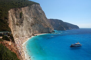Scenic shot of the cliffs and the Porto Katsiki beach packed with tourists in Lefkada, Greece