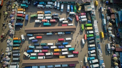 Aerial shot of a lorry station full of colorful cars, Ghana