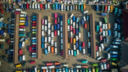 Aerial shot of a lorry station full of colorful cars, Ghana