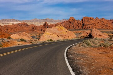 Landscape of a highway road through a desert at sunrise at Valley of Fire
