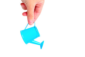 Miniature Watering Can in Hand on White © Katie Chizhevskaya