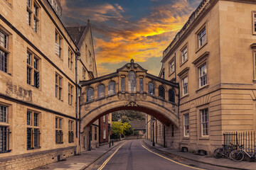 Fototapeta na wymiar The Bridge of Sighs or Hertford Bridge at sunset, is between Hertford College university buildings in New College Lane street, in Oxford, Oxfordshire, England