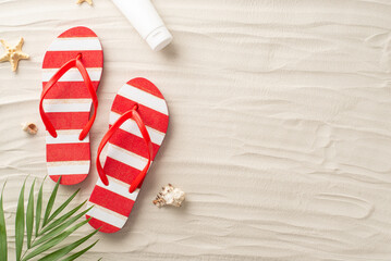 Take in beauty of sun-soaked relaxation from top view. Explore red flip-flops, sunscreen lotion...
