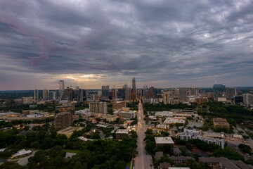 Naklejka na ściany i meble Drone shot of Austin cityscape under stormy sky in Texas