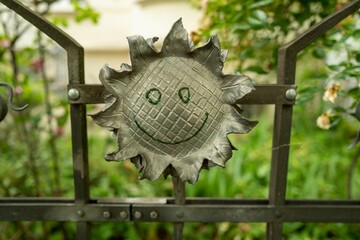 laughing sunflower made of metal