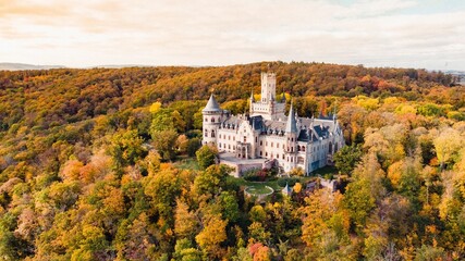Aerial shot of Marienburg castle in Germany in autumn at sunset © Trongtrungeuro/Wirestock Creators