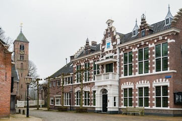 Group of brick traditional buildings such as houses and church