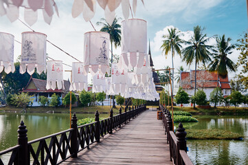 Lanterns hang to decorate the bridge in front of the temple in Sukhothai Old City Park