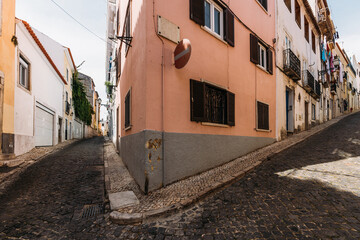 Fototapeta na wymiar Wide angle view of narrow streets in the historic centre of Lisbon, Portugal