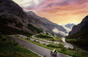 Naklejka premium Moto trip. Lifestyle and travel. Beautiful landscape. A road through the Alp mountains.
