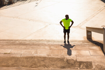 Fitness training outdoors. Handsome African man running. Muscular man training..