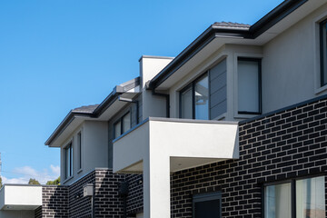 New modern residential townhouse homes. Building of suburban semi-detached townhomes. Concept of...