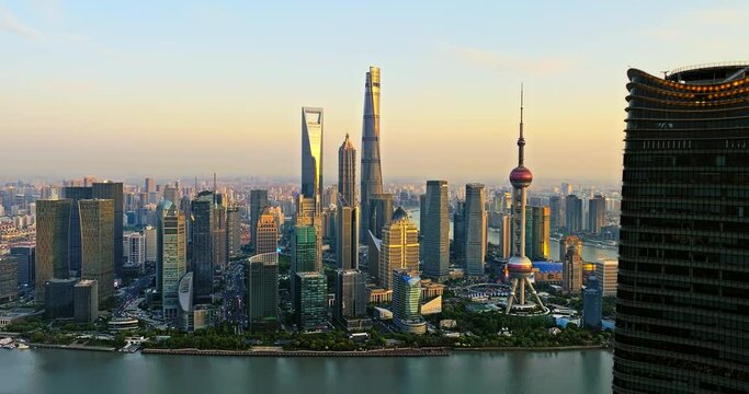 Aerial footage of city skyline and modern buildings in Shanghai at sunset, China. Famous city landmarks in China.