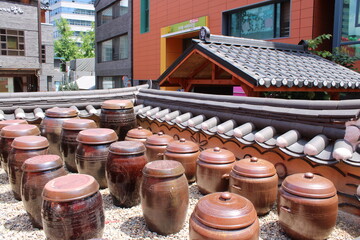 Korean ceramic fermentation jars on rooftop terrace