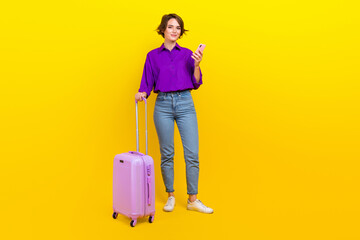 Full body photo of attractive young woman device suitcase dressed stylish purple smart casual...