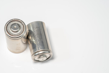 Alkaline batteries lie on white background, The concept of vital energy reserve