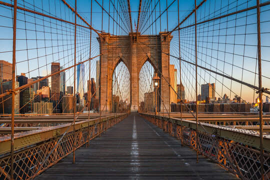 The Brooklyn bridge lighten by strong morning sunlight.