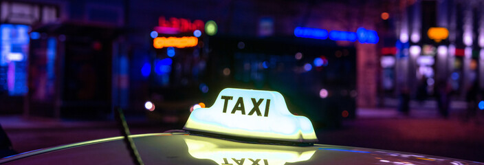 car with taxi sign