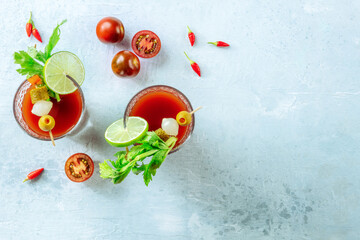 Bloody Mary cocktail with garnish, shot from the top with a place for text. Spicy tomato juice with...