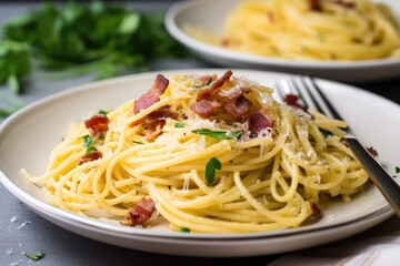 serving of spaghetti carbonara topped with freshly cracked black pepper, created with generative ai