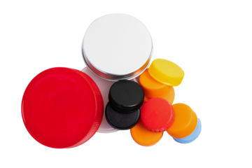 A pile of plastic bottle caps and jars isolated on white. Recyclable trash