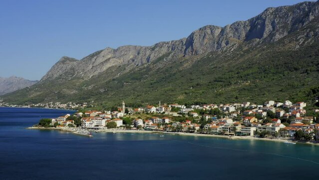 Aerial view of Gradac town below Biokovo mountain, the Adriatic Sea, Croatia