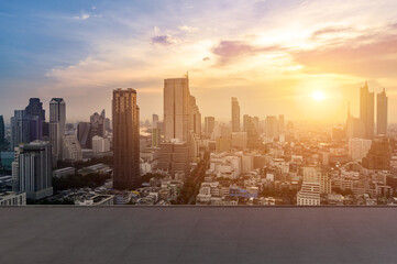 cityscape and skyline of Bangkok urban in twilight time on view from empty concrete floor.
