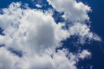 blue sky with fluffy clouds	
